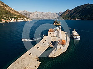 Boats moored near the island of Gospa od Skrpjela. Aerial view