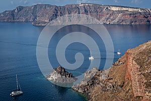 Boats moored in the old volcanic caldera in Santorini