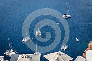 Boats moored in the old volcanic caldera in Santorini