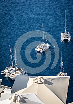 Boats moored in the old volcanic caldera in Santorini