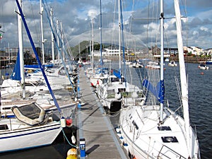 Boats moored at Porthmadog harbor.