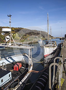 Boats moored at quayside at Amlwch Port on Anglesey, Wales, UK.