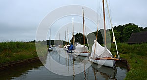 Boats moored at the staithe at Horsey Norfolk.