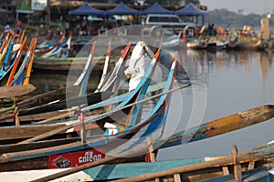 Boats moored at Taungthaman Lake near Amarapura in Myanmar by the U Bein Bridge