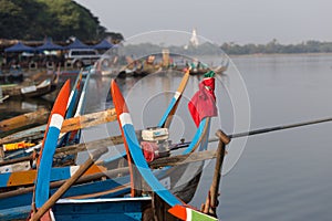 Boats moored at Taungthaman Lake near Amarapura in Myanmar by the U Bein Bridge