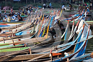 Boats moored at Taungthaman Lake near Amarapura in Myanmar by the U Bein Bridge