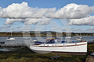 Boats moored on tidal river in Sussex, England