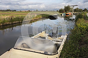 Boats moored at the waterfront in municipality Midden-Delfland