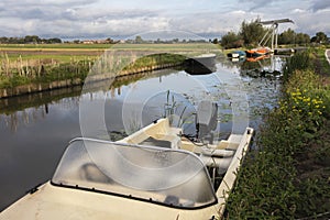 Boats moored at the waterfront in municipality Midden-Delfland photo
