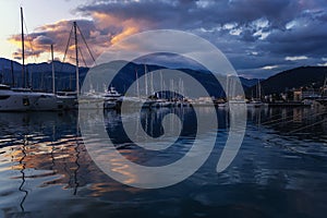 Boats, motorboats and yachts in the port at sunset in Tivat, Porto Monetengro, sea travel and adventures