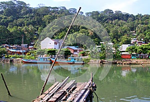 Boats on the Batang Arau River in Padang, West Sumatra photo