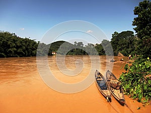Boats on muddy river