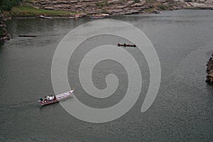 Boats in Narmada river carrying tourists and pilgrims