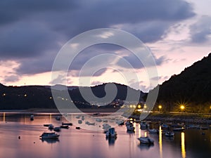 Boats at the natural district of Urdaibai at dusk photo