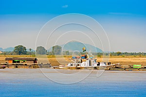 Boats near the bank of the river Irravarddy, Mandalay, Myanmar, Burma. Copy space for text.