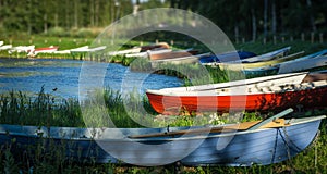 Rowboats at lake shore photo