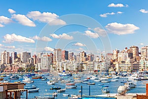 Boats near the pier and view of Alexandria coast, Egypt