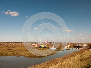 Boats parked along estuary marshland in tollesbury maldon