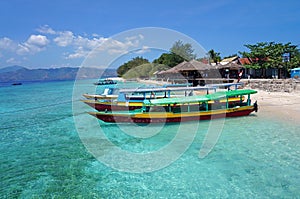 Boats parked along Gili Menos Shoreline photo