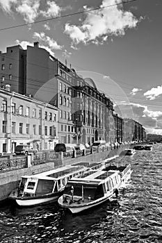 Boats parking in city channel