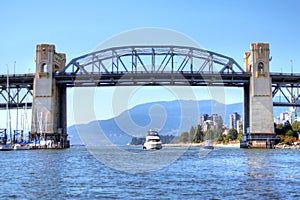 Boats Pass Under Burrard Bridge On False Creek in Vancouver