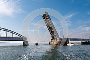 Boats passing Oddesund Bridge over Oddesund Strait in Limfjord, Midtjylland, Denmark