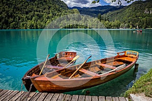 Boats at the pier of the Bled Island, Lake Bled