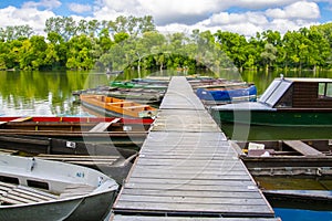 Boats and pier on the river of Tisza