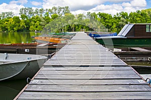 Boats and pier on the river of Tisza