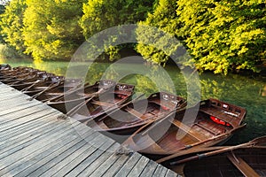 Boats in Plitvice lakes, Croatia. National Park in summer. Lakes among the forest