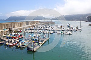 Boats in a port in Lastres, Asturias photo