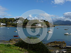 Boats in Porthmadog Harbour with a view of Snowdonia Mountains