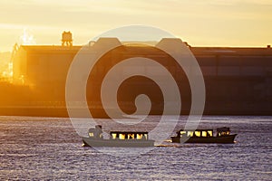 Boats in Portugalete at sunset