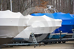 Boats protected by shrink wrap photo