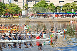 Boats racing in the Love River for the Dragon Boat Festival in Kaohsiung, Taiwan.