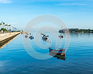 Boats rest on pretty blue sea in Havana, Cuba.