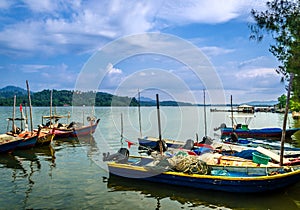 Boats on the river on blue sky background