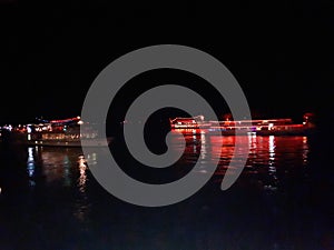 Boats on the river at night