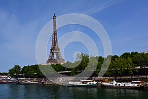 Boats on the River Seine and The Eiffel Tower in the distance, Paris, France
