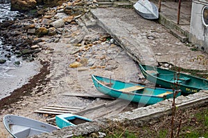 Boats on a rocky shore - sea pier, boat station