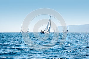 Boats sail regatta with sailboats in mediterranean