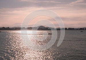 Boats sailing in the Cantabrian Sea at sunset