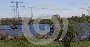 Boats sailing on the waters of the Oude Maas river, Molenplas nature reserve