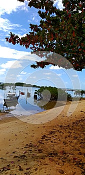 Boats in the sea on the coast at the beach in Santa Cruz CabrÃ¡lia, Bahia, Brazil.