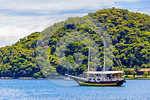 Boats ships and Boat trips Abraao beach Ilha Grande Brazil photo