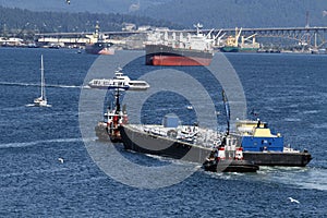 Boats and ships in busy Vancouver British Columbia Canada Harbour.