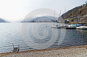 Boats on the shore of Lago di Lugano, Switzerland photo