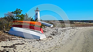 Boats on the Shore with Lighthouse