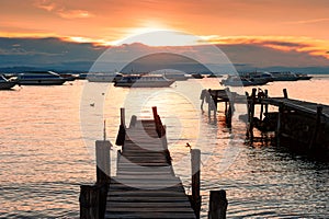 Boats on the shore of Titicaca lake at sunset in Copacabana, Bolivia