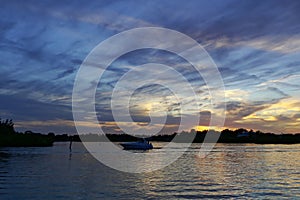 Boats silhouetted against the sunset, Tarpon Springs, Florida, Anclote River